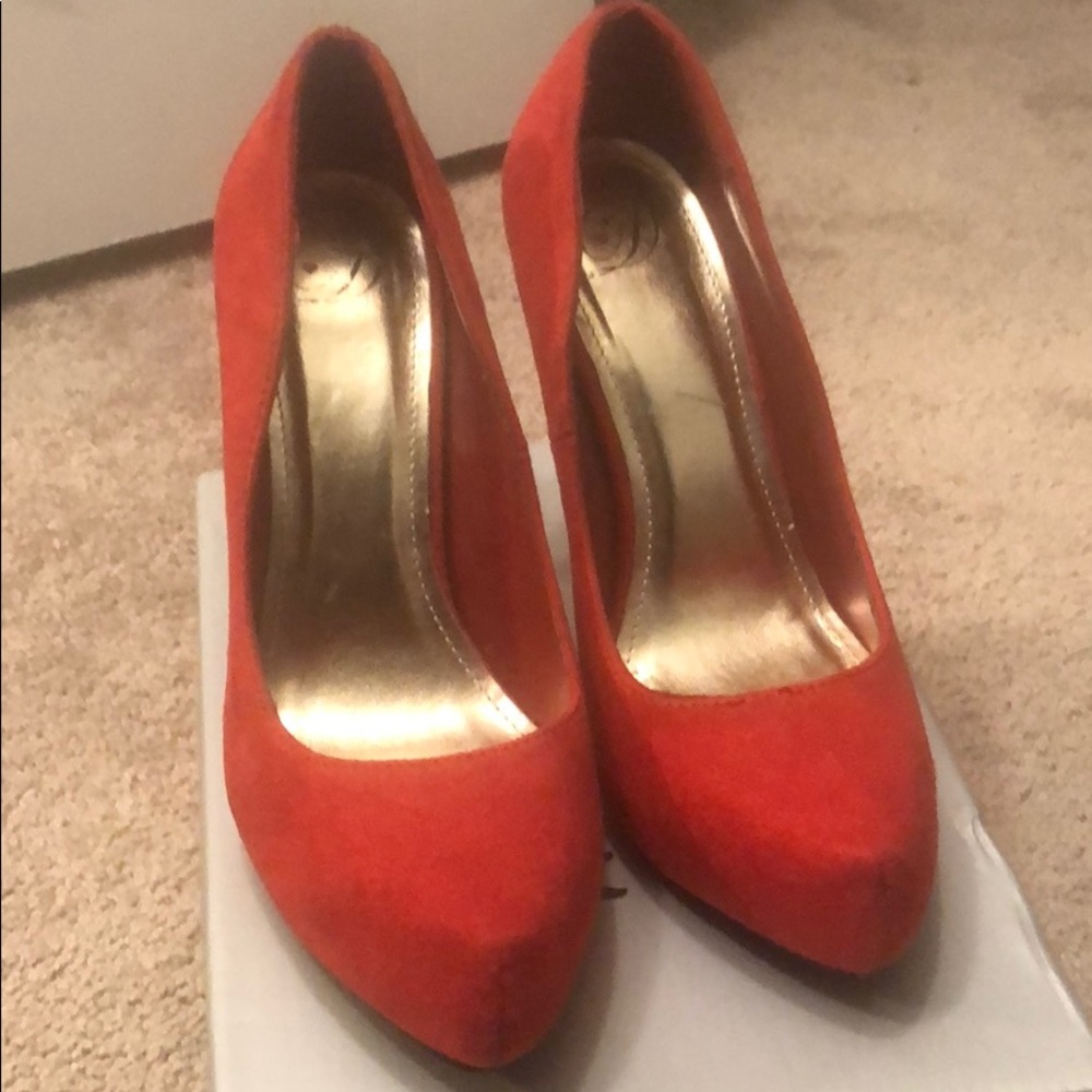 Red suede pumps